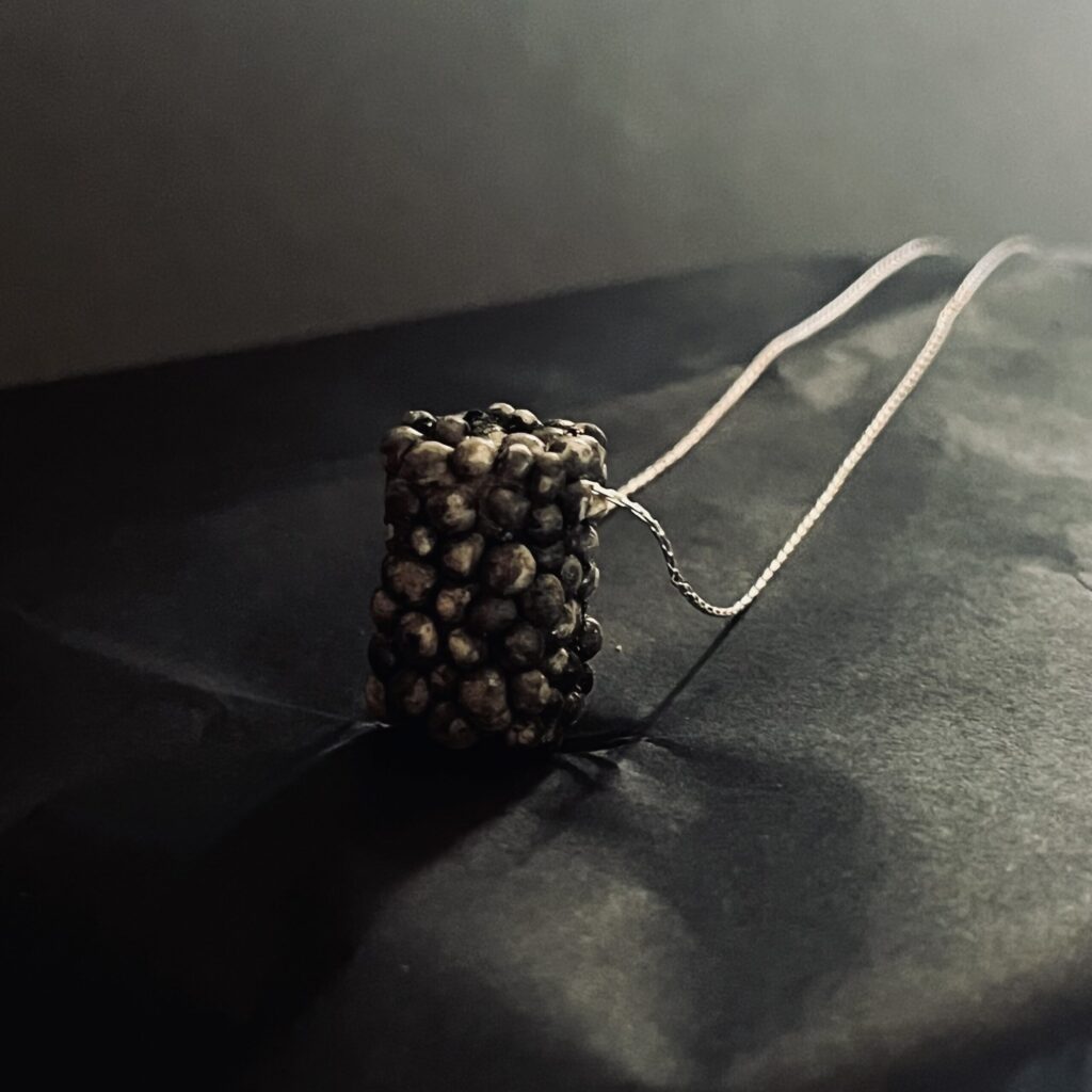 Pendant in eggshell porcelain and silver